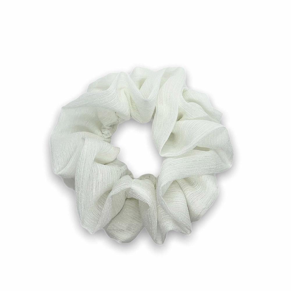 Ivy scrunchie is a must have in your accessory collection! It's an oversized scrunchie with shimmer which creates a puffy look in your hair. Use it in a messy bun or to spice up your ponytail.